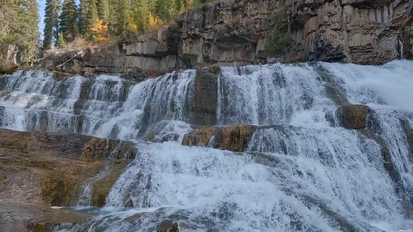 Following waterfall flowing down cascade at Granite Creek