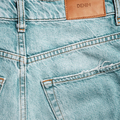 Back of blue jeans close up. Label with the inscription DENIM Fashionable casual wear. - PhotoDune Item for Sale