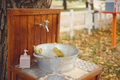 Outdoor washbasin in the yard, faucet, basin and soap. Autumn time, yellow foliage. - PhotoDune Item for Sale