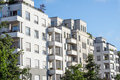 White apartment building with trees - PhotoDune Item for Sale