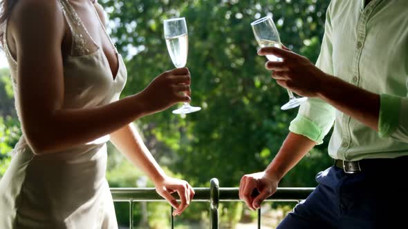 Romantic couple toasting champagne glasses