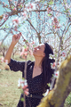 Happy female with eyes closed smelling flowers - PhotoDune Item for Sale
