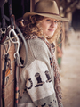 Stylish fair haired female in cowboy wear - PhotoDune Item for Sale