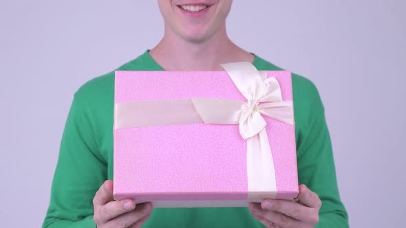 Happy Young Handsome Man with Gift Box Ready for Valentine's Day