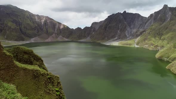 Aerial view of volcanic Lake Pinatubo and mountains, Porac, Philippines.