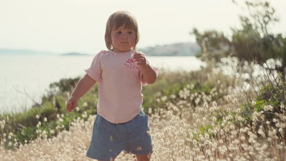 Beautiful Little Girl Takes Her First Steps with Her Feet