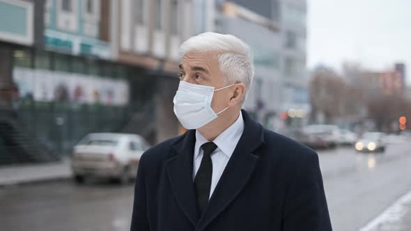 Businessman in Coat Tie and Facemask on Street During Covid19 Virus Pandemic