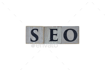 Wooden cubes showing the letters SEO (Search Engine Optimization) on white background