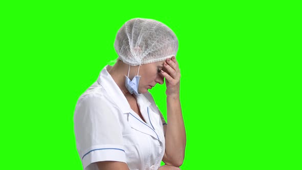 Upset Doctor on Green Screen, Side View.