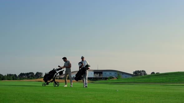 Golfers Discuss Course Game Competition Outside