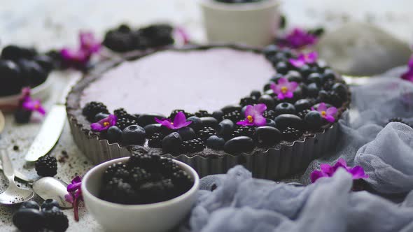 Sweet and Tasty Tart with Fresh Blueberries Blackberries and Grapes Served on Stone Background