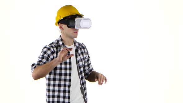 Engineer in Yellow Helmet Works with Help of Vr Glasses