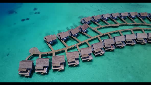 Aerial landscape of tranquil lagoon beach wildlife by turquoise lagoon with white sandy background o