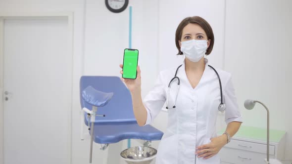 Gynecologist Shows an Smartphone with a Chromakey