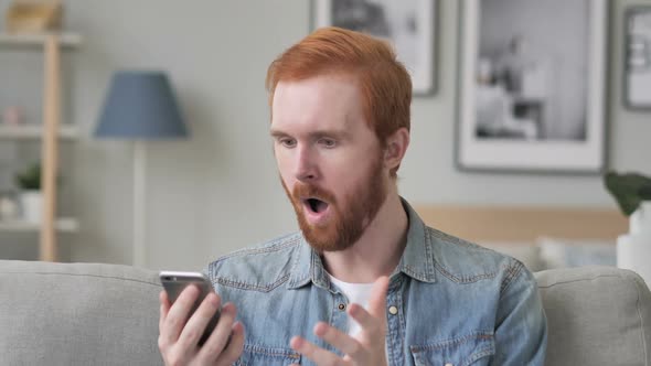 Shocked Creative Beard Man Using Smartphone