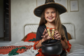 Portrait of elementary age girl wearing witch costume - PhotoDune Item for Sale