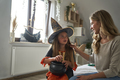 Caucasian mother and daughter dressing up before Halloween party - PhotoDune Item for Sale