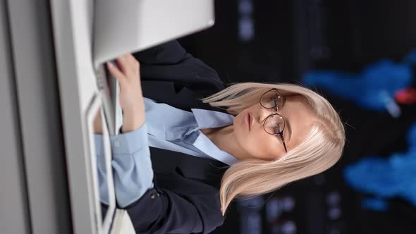 VERTICAL VIDEO POV Young Blonde Business Woman Working Use Laptop at Innovation Infographics Screen