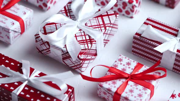 Christmas Concept. Close Up on Festive Paper Wrapped Gifts with Ribbon