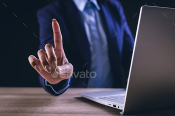 Biracial businesswoman using laptop and holographic display with copy space