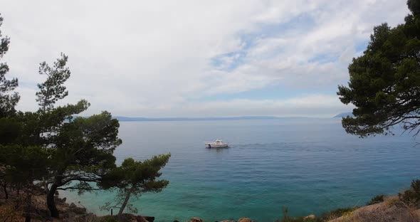 Beautiful Nature Overlooking the Adriatic Sea in Which Sails White Yacht in summer