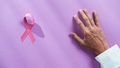 Doctor hand ad Pink ribbon On The Table - PhotoDune Item for Sale