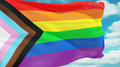 Rainbow flag flutters in the wind. New LGBTQ+ rights symbol. - PhotoDune Item for Sale