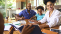 Family Around Table At Home Using Laptop With Parents Helping Children With Science Homework - PhotoDune Item for Sale
