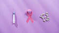 Pink ribbon pills and syringe - PhotoDune Item for Sale