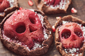 Halloween food. Homemade tartlets with jam and scary skull-shaped pears.  - PhotoDune Item for Sale