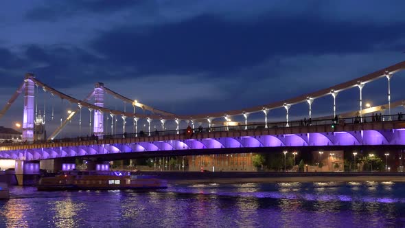 Night Cityscape with Illuminated Bridge at Modern Embankment