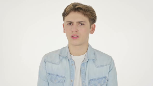 Young Man Showing No Sign By Shaking Head on White Background