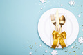 Christmas or new year table setting with golden cutlery on the blue background with copy space - PhotoDune Item for Sale