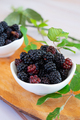 Wild berries in their natural state on a wooden cutting board - PhotoDune Item for Sale