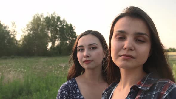 Two Sisters Walk in Nature and Communicate