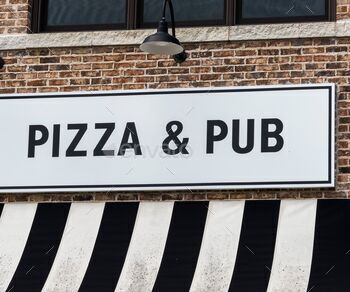 Pizza and hub sign on the building