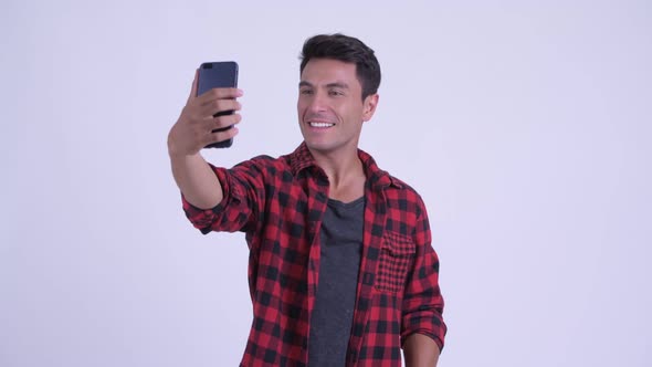 Happy Young Hispanic Hipster Man Taking Selfie