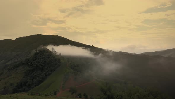 Aerial mountains valley view with clouds sunset time