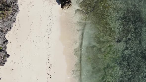 Vertical Video of the Ocean Near the Coast of Zanzibar Tanzania Aerial View