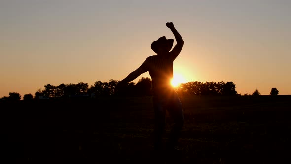 Happy Male Farmer Having Fun Dancing at Sunset