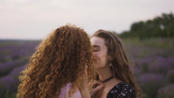 Two Sensual Women Among a Lavender Field Funny Rubbing Their Noses