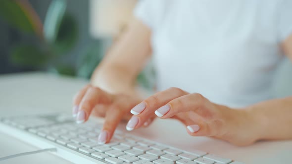 Female Hands Typing on a Computer Keyboard