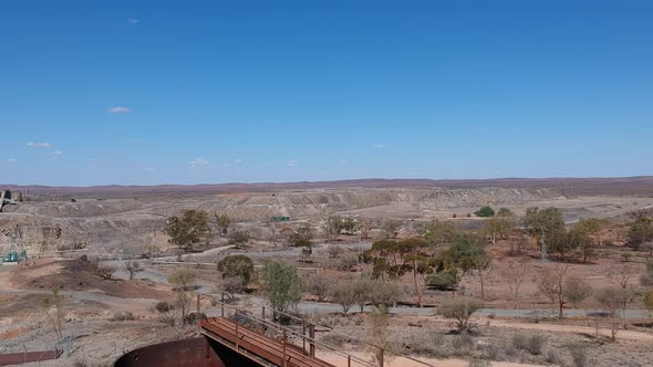 Drone flying over broken hill