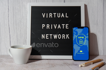rotocols for protection private network Letter board text VIRTUAL PRIVATE NETWORK anonymous safe and secure internet access on smartphone on workplace background with coffee pen and notebook. Future technologies