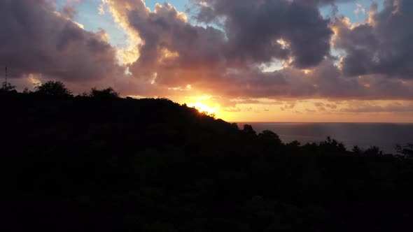 The beautiful bright orange sunset over the horizon of Fiji - wide rising