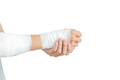Young man with gauze bandage wrapped around injury hand on white background - PhotoDune Item for Sale