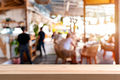 Empty wooden table space platform and blurry defocused restaurant and coffee shop - PhotoDune Item for Sale