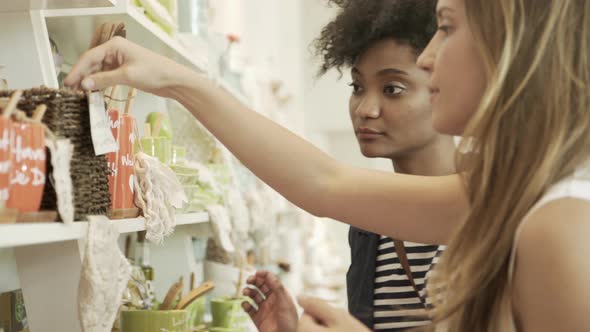 Women browsing merchandise on store shelves