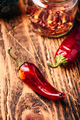 Dried red chili peppers on wooden surface - PhotoDune Item for Sale