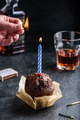 Hand lighting candle on birthday muffin - PhotoDune Item for Sale
